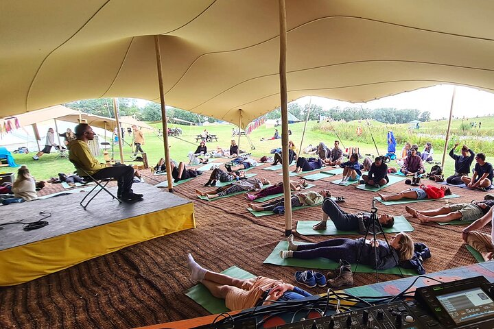 Ryan leading a mass meditation at We Out Here festival in 2021.